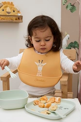 STERNTALER silikonski slinček z žepkom, nastavljiv, BPA FREE