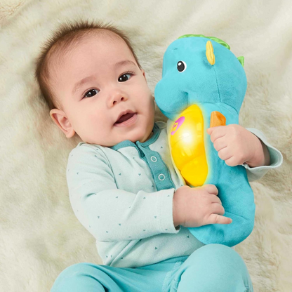 FISHER-PRICE peluche con melodías, sonidos y luz CABALLITO DE MAR para bebés